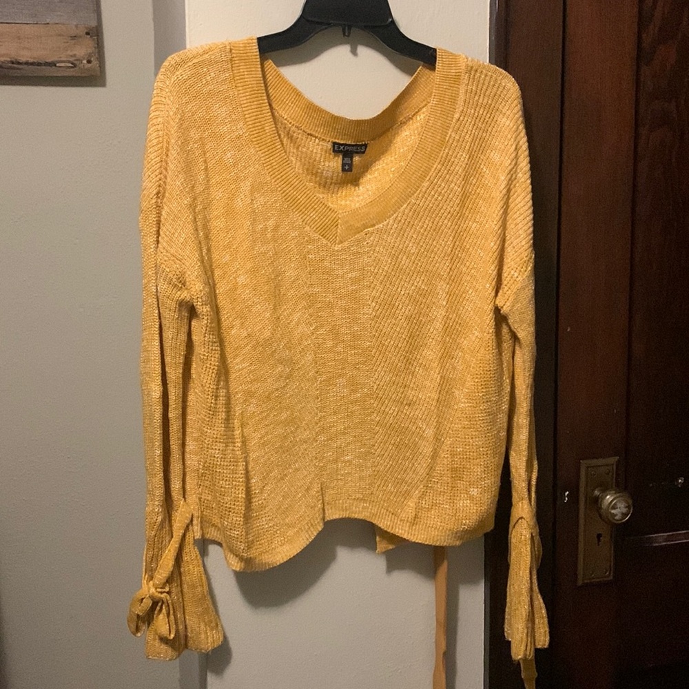Express Sweater, bell sleeves, open back.